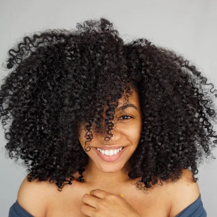 Woman with defined spiral ringlets