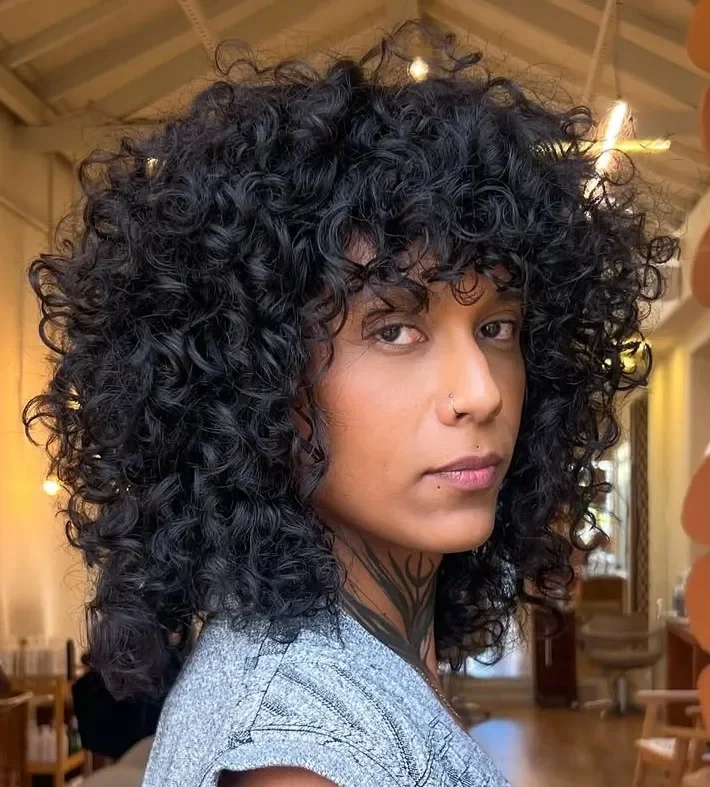 Woman with a curly shag haircut