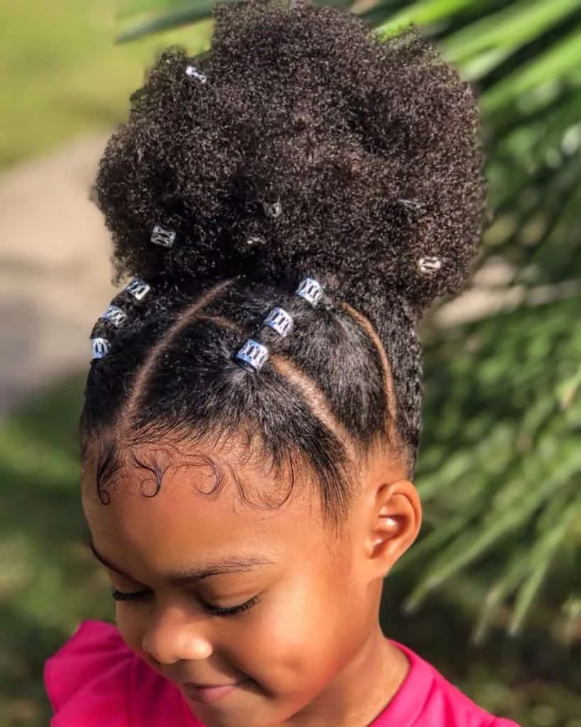 Toddler with a messy top knot