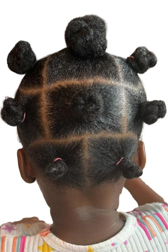 Toddler with bantu knot accents