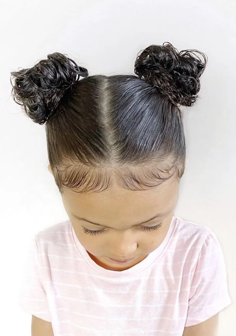 Toddler with a puffball crown ponytail