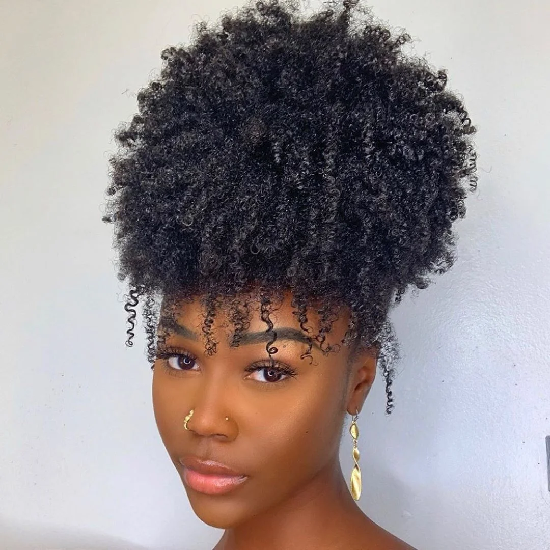 Woman with a high pineapple puff hairstyle