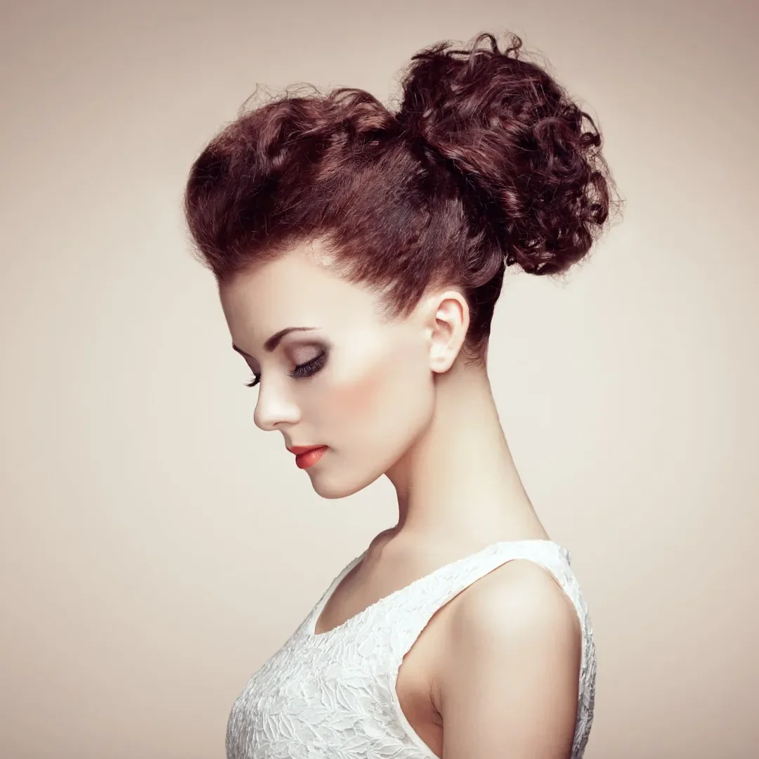Woman with voluminous curly updo and crown height