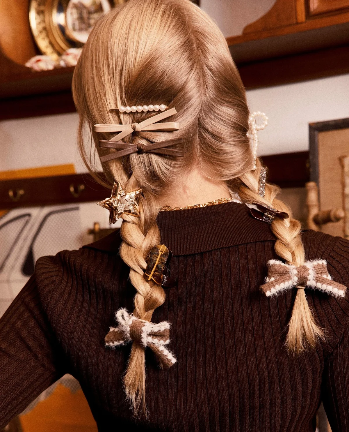 Intricate blonde braid ornamented with delicate gold hair clips