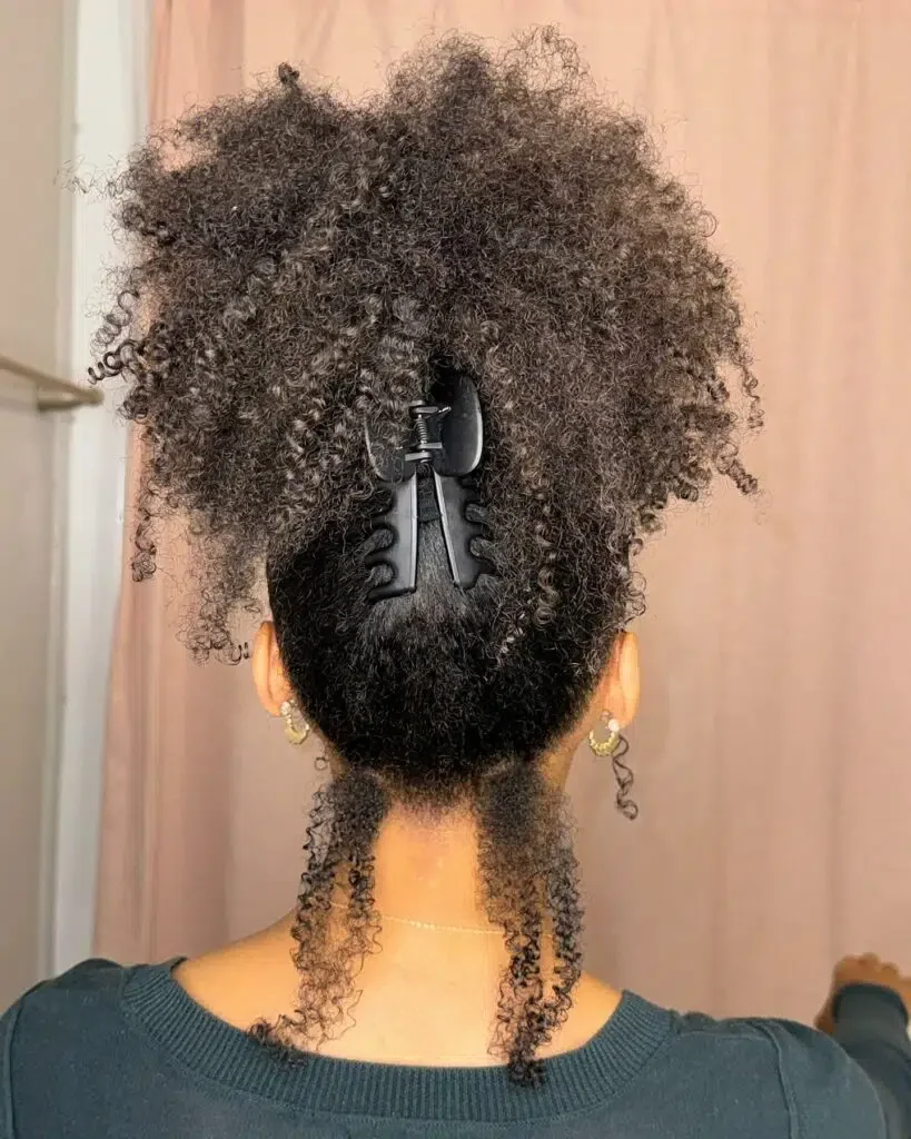 Woman with a curly claw clip updo