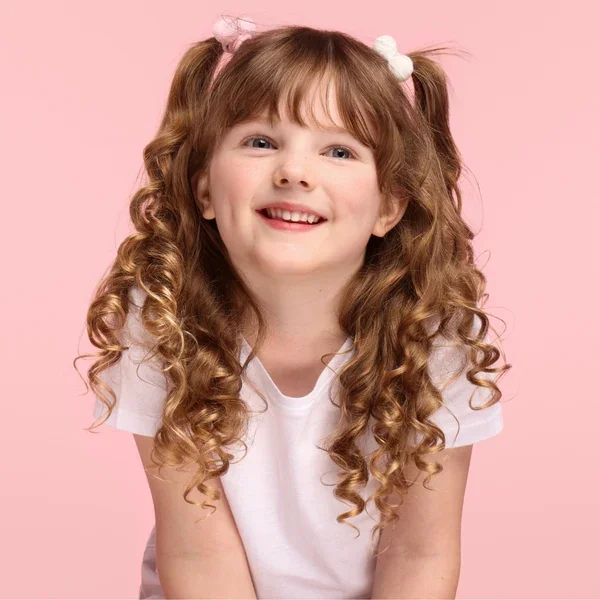 Girl with curly pigtails