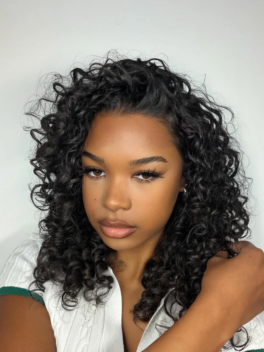Teen with a side part and voluminous curly hair