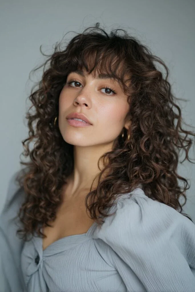 Teen with curly curtain bangs