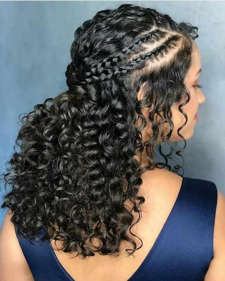 Woman with twisted crown accent in curly half up hair
