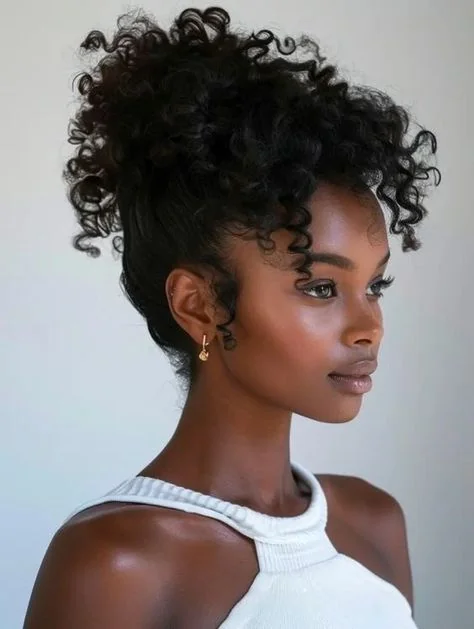 Woman with a pineapple puff and curly bangs