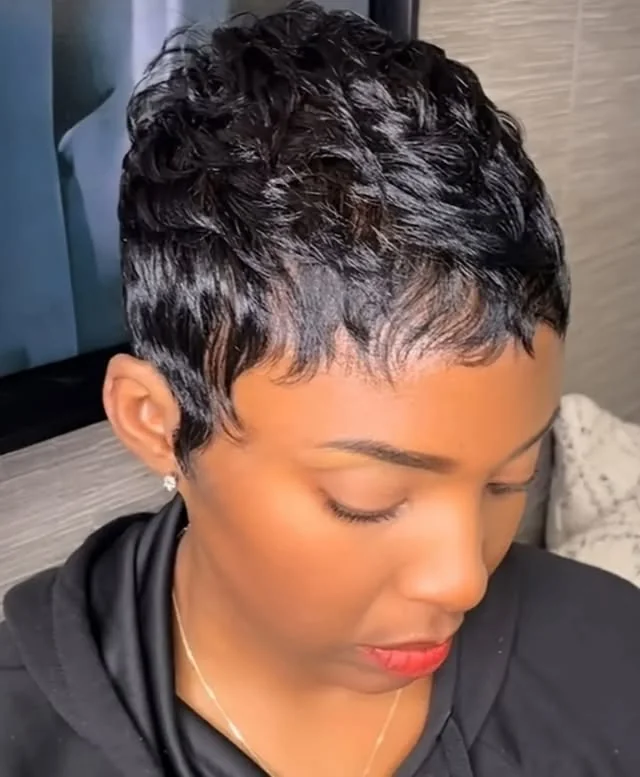 Woman with wet look curls pixie