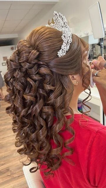 Woman with a tiara with curly prom hair