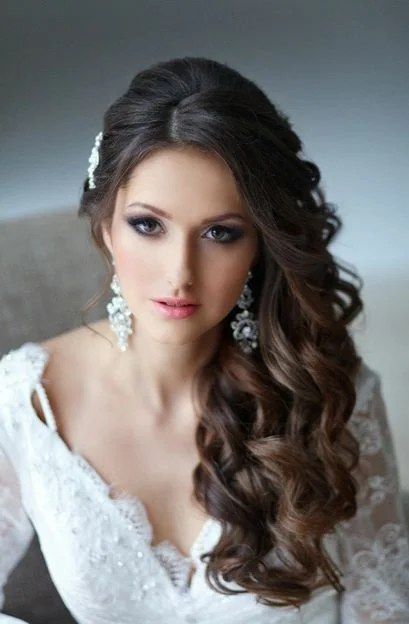 Woman with side swept curly hair for prom