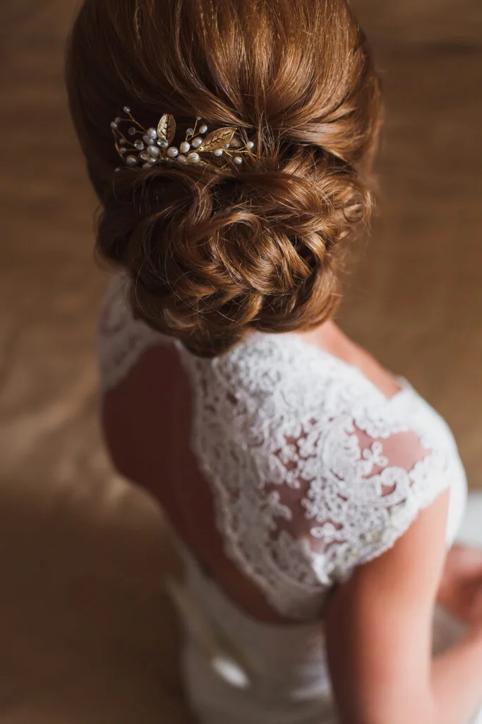 Bride with a soft curly side bun
