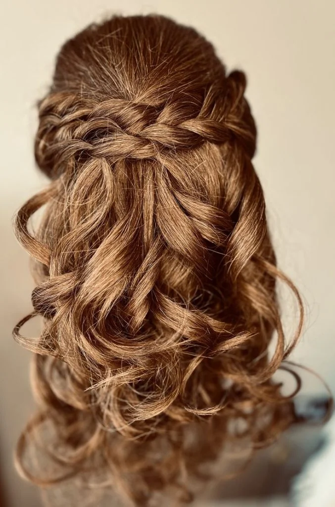 Bride with a twisted french roll in curly hair
