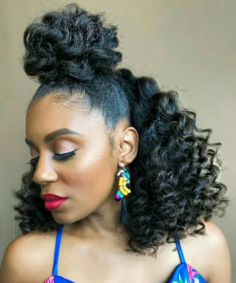 Woman with a high puff ponytail of defined curls