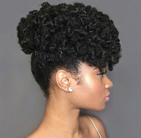 Woman with a curly puff updo