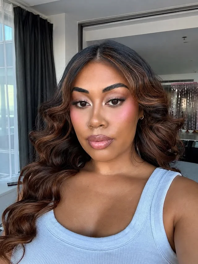 Long vintage Hollywood waves with full glam makeup.